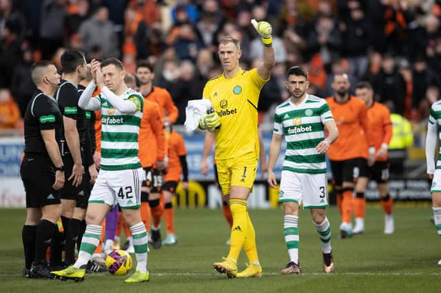 Callum McGregor, far left, takes the acclaim from the Celtic support after the win over Dundee United.