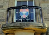 The crest from the University of St Andrews. Funding for universities and colleges has been cut by 46 million pounds
