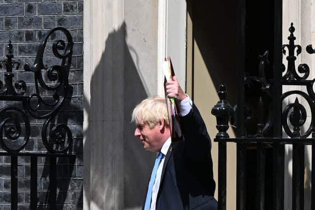 Prime Minister Boris Johnson reacts as he leaves from 10 Downing Street in central London. Picture: Justin Tallis/AFP via Getty Images