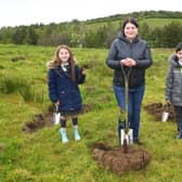 Councillor Susan Aitken, chair of Glasgow City Region cabinet and leader of Glasgow City Council, gets digging with local children as plans are unveiled to plant 18 million trees - ten for every adult and child in the area - as part of the new Clyde Climate Forest initiative