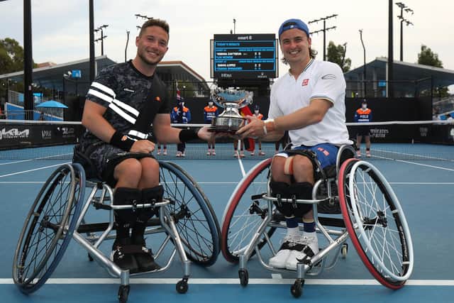 Alfie Hewett and Rangers fan Gordon Reid pose with the trophy after their victory over Gustavo Fernandez and Shingo Kunieda in the final of the Men's Wheelchair Doubles at the Australian Open. (Photo by Graham Denholm/Getty Images)