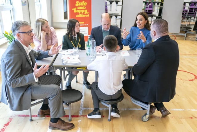 The royals sit down with staff and pupils.