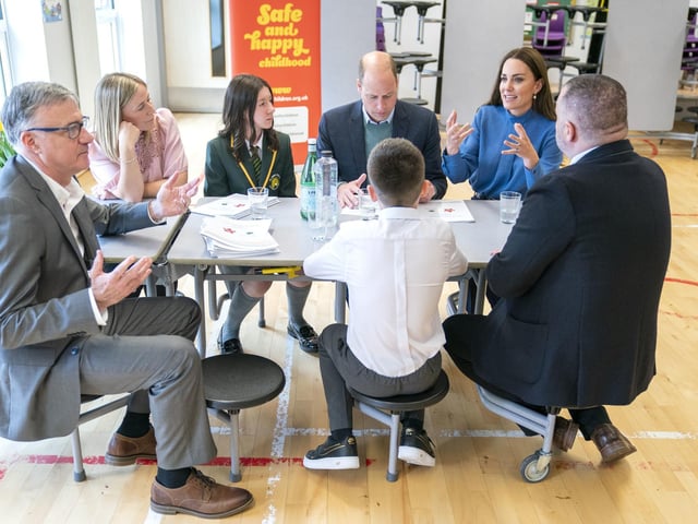 The royals sit down with staff and pupils.