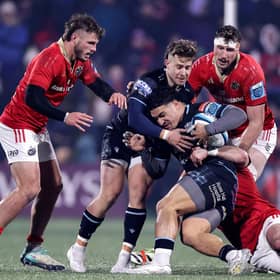 Glasgow Warriors' Sione Tuipulotu is tackled by Diarmuid Barron of Munster. Photo by Laszlo Geczo/INPHO/Shutterstock.