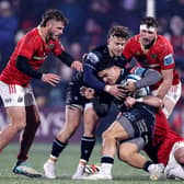 Glasgow Warriors' Sione Tuipulotu is tackled by Diarmuid Barron of Munster. Photo by Laszlo Geczo/INPHO/Shutterstock.