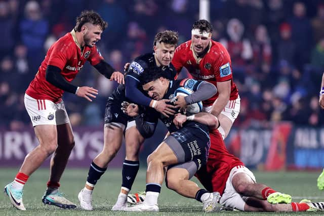 Glasgow Warriors' Sione Tuipulotu is tackled by Diarmuid Barron of Munster. Photo by Laszlo Geczo/INPHO/Shutterstock.