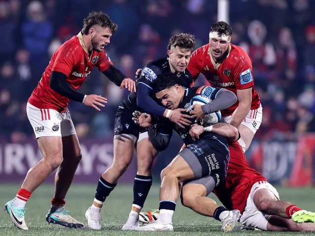 Glasgow Warriors' Sione Tuipulotu is tackled by Diarmuid Barron of Munster. Photo by Laszlo Geczo/INPHO/Shutterstock.
