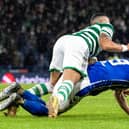 Kilmarnock appeal for a penalty as defender Joe Wright falls under a challenge from Celtic’s Giorgos Giakoumakis. (Photo by Alan Harvey / SNS Group)