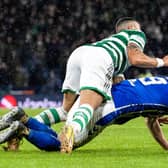 Kilmarnock appeal for a penalty as defender Joe Wright falls under a challenge from Celtic’s Giorgos Giakoumakis. (Photo by Alan Harvey / SNS Group)