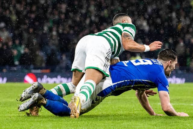 Kilmarnock appeal for a penalty as defender Joe Wright falls under a challenge from Celtic’s Giorgos Giakoumakis. (Photo by Alan Harvey / SNS Group)
