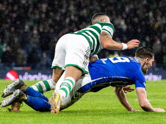 Kilmarnock appeal for a penalty as defender Joe Wright falls under a challenge from Celtic’s Giorgos Giakoumakis. (Photo by Alan Harvey / SNS Group)