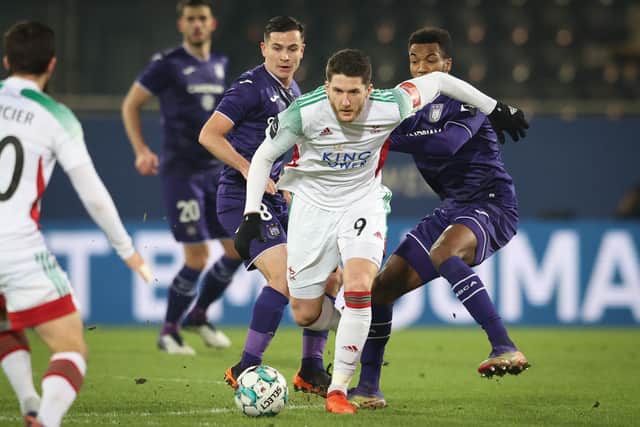 Thomas Henry looks to escape the attentions of Anderlecht's Hannes Delcroix fight for the ball during a Jupiler Pro League clash