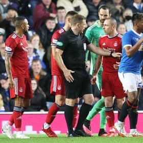 Aberdeen's Scott Brown complains to referee John Beaton during the 2-2 draw with Rangers at Ibrox. Picture: SNS