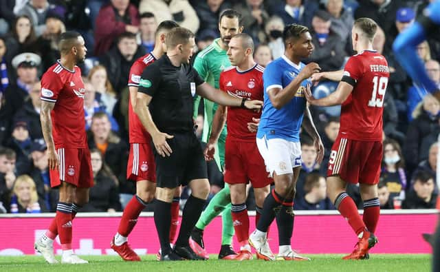 Aberdeen's Scott Brown complains to referee John Beaton during the 2-2 draw with Rangers at Ibrox. Picture: SNS