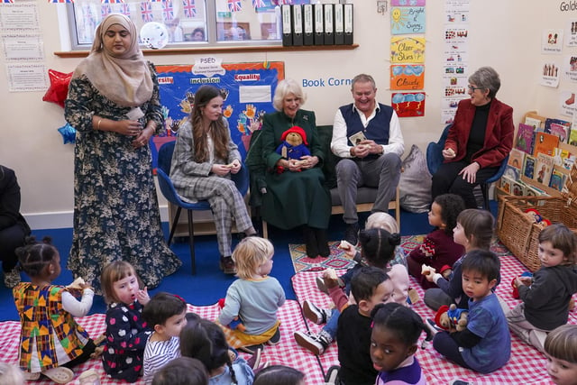 The Queen Consort with (second left to right) actors Madeleine Harris, Hugh Bonneville, and the daughter of Paddington author Michael Bond, Karen Jankel, during a special teddy bears picnic at a Barnardo's Nursery in Bow, London,