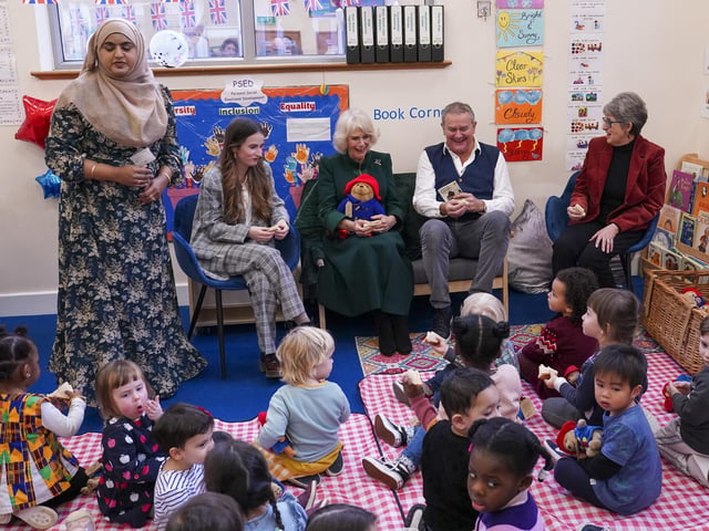 The Queen Consort with (second left to right) actors Madeleine Harris, Hugh Bonneville, and the daughter of Paddington author Michael Bond, Karen Jankel, during a special teddy bears picnic at a Barnardo's Nursery in Bow, London,