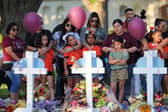 Mourners visit memorials for victims of Tuesday's mass shooting at a Texas elementary school.