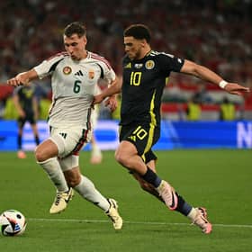 Hungary defender Willi Orban fights for the ball with Scotland forward Che Adams during Sunday's Euro 24 match (Picture: Fabrice Coffrini/ AFP via Getty Images)