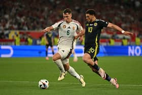 Hungary defender Willi Orban fights for the ball with Scotland forward Che Adams during Sunday's Euro 24 match (Picture: Fabrice Coffrini/ AFP via Getty Images)