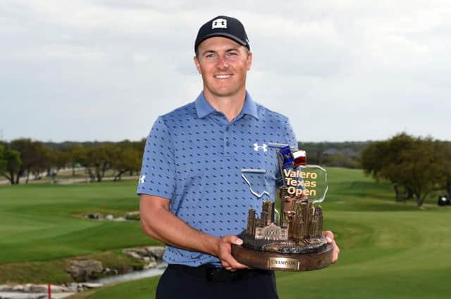 Jordan Spieth poses with the trophy after his win in the Valero Texas Open at TPC San Antonio Oaks Course. Picture: Steve Dykes/Getty Images.