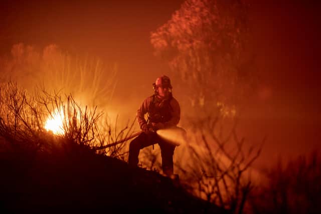 A firefighter battles the Alisal Fire near Goleta, California earlier this month (Picture: David McNew/Getty Images)