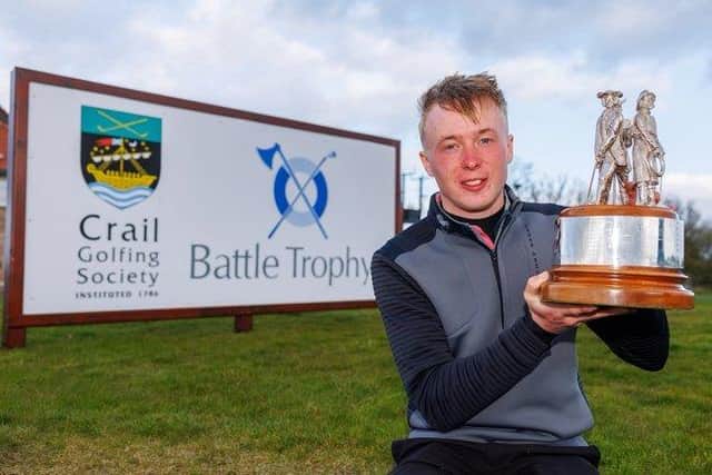 Schloss Roxburghe player Jack McDonald shows off the Battle Trophy after storming to a nine-shot success at Crail Golfing Society. Picture: Kenny Smith