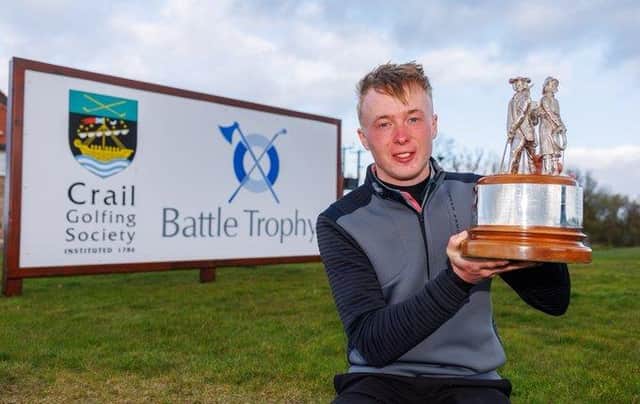 Schloss Roxburghe player Jack McDonald shows off the Battle Trophy after storming to a nine-shot success at Crail Golfing Society. Picture: Kenny Smith