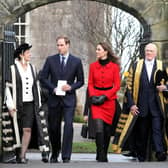 Prince William and Kate Middleton pass St Salvator's halls, accompanied by Sir Menzies Campbell (right), during a visit to St Andrews University. Picture Andrew Milligan/PA Wire