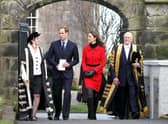 Prince William and Kate Middleton pass St Salvator's halls, accompanied by Sir Menzies Campbell (right), during a visit to St Andrews University. Picture Andrew Milligan/PA Wire