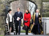 Prince William and Kate Middleton pass St Salvator's halls, accompanied by Sir Menzies Campbell (right), during a visit to St Andrews University. Picture Andrew Milligan/PA Wire
