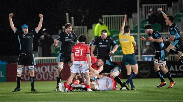 Glasgow players celebrate at the full time whistle during a United Rugby Championship match between Glasgow Warriors and Munster at Scotstoun Stadium, on February 11, 2022, in Glasgow, Scotland. (Photo by Ross MacDonald / SNS Group)