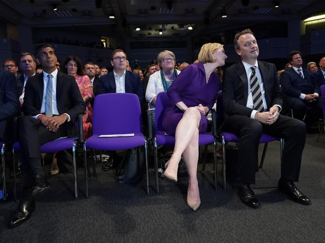 Liz Truss and her husband Hugh O'Leary, at the Queen Elizabeth II Centre in London ahead of the announcement