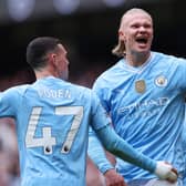 Erling Haaland of Manchester City celebrates scoring his team's first goal during the Premier League match between Manchester City and Everton FC at Etihad Stadium on February 10, 2024 in Manchester, England. (Photo by Alex Livesey/Getty Images)