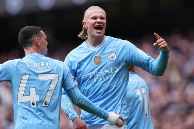 Erling Haaland of Manchester City celebrates scoring his team's first goal during the Premier League match between Manchester City and Everton FC at Etihad Stadium on February 10, 2024 in Manchester, England. (Photo by Alex Livesey/Getty Images)