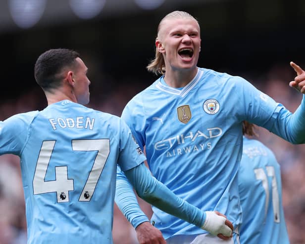 Erling Haaland of Manchester City celebrates scoring his team's first goal during the Premier League match between Manchester City and Everton FC at Etihad Stadium on February 10, 2024 in Manchester, England. (Photo by Alex Livesey/Getty Images)