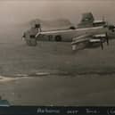 A Halifax aircraft from RAF 518 Squadron airborne over Tiree during World War II. (Photograph from Mike Hughes/An Iodhlann)