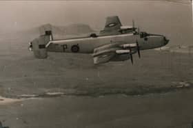 A Halifax aircraft from RAF 518 Squadron airborne over Tiree during World War II. (Photograph from Mike Hughes/An Iodhlann)