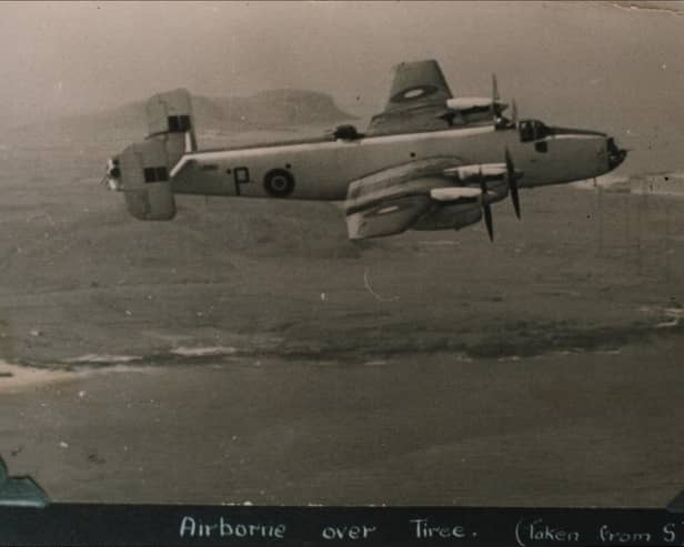 A Halifax aircraft from RAF 518 Squadron airborne over Tiree during World War II. (Photograph from Mike Hughes/An Iodhlann)