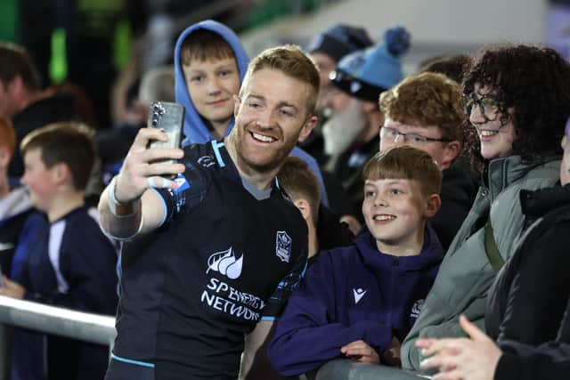 Glasgow Warriors captain Kyle Steyn with fans after the 21-10 win over Hollywoodbets Sharks at Scotstoun Stadium. (Photo by Ross MacDonald / SNS Group)