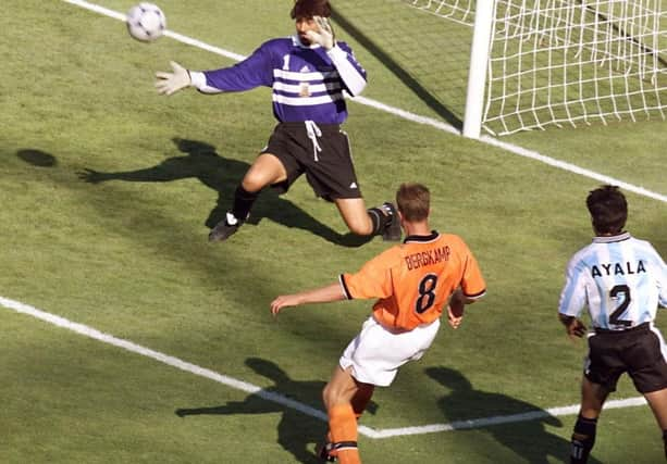 Netherlands legend Dennis Bergkamp scores his iconic last minute winner against Argentina in the 1998 World Cup finals (Photo credit should read GEORGES GOBET/AFP via Getty Images)