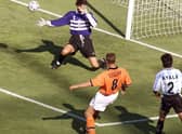 Netherlands legend Dennis Bergkamp scores his iconic last minute winner against Argentina in the 1998 World Cup finals (Photo credit should read GEORGES GOBET/AFP via Getty Images)