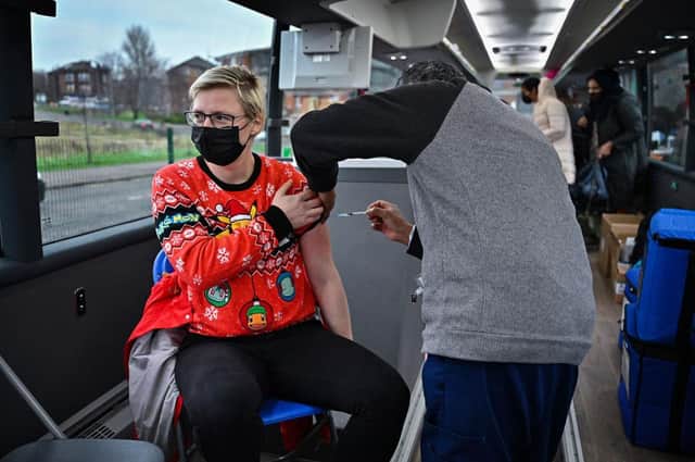 Members of the public receive vaccinations on a vaccination bus at West College Scotland's Clydebank Campus (Picture: Jeff J Mitchell/Getty Images)