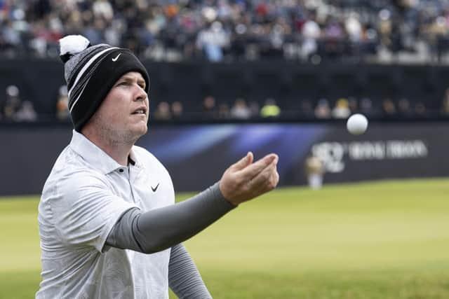 Bob MacIntyre throws his golf ball to young fans in the grandstand after completing the final round in the 152nd Open at Royal Troon. Picture: Tom Russo/The Scotsman