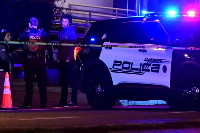 Police patrol the scene along Garvey Avenue in Monterey Park, California, on January 21, 2023, where police are responding to reports of multiple people shot. (Photo by Frederic J. BROWN / AFP)