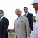 Britain's Prince Charles and Camilla, Duchess of Cornwall, are pictured during a visit to the Giza Pyramids plateau on the western outskirts of the Egyptian capital Cairo on November 18, 2021.