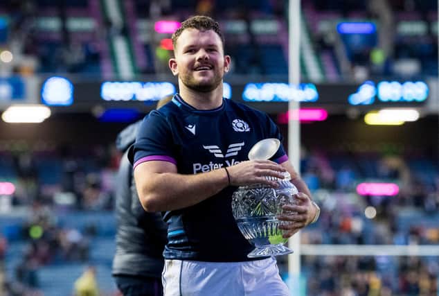 Ewan Ashman celebrates with the Hopetoun Cup after Scotland's win over Australia. (Photo by Ross Parker / SNS Group)
