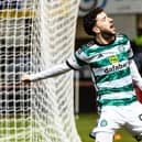 Celtic's Mikey Johnston celebrates after scoring to make it 3-0 over Dundee. (Photo by Ross Parker / SNS Group)