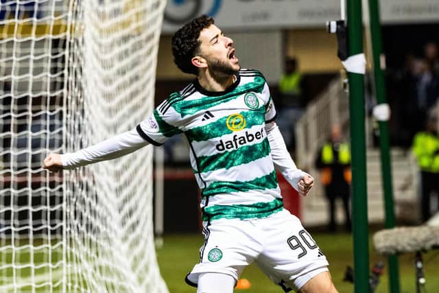 Celtic's Mikey Johnston celebrates after scoring to make it 3-0 over Dundee. (Photo by Ross Parker / SNS Group)