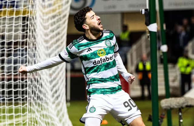 Celtic's Mikey Johnston celebrates after scoring to make it 3-0 over Dundee. (Photo by Ross Parker / SNS Group)