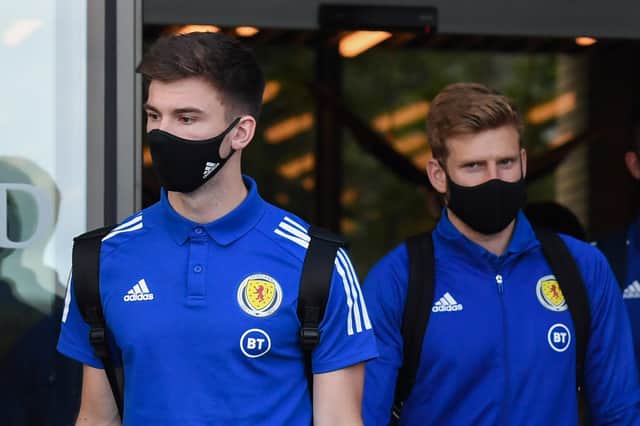 Kieran Tierney, left, and Stuart Armstrong, right, are among the Scotland players missing for tomorrow's clash with Israel.